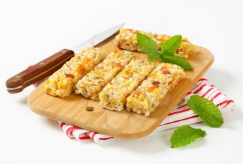 Cereal bars with pieces of dried apricot and apple