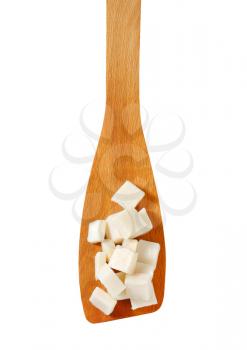 Cubes of rendered lard on wooden spatula