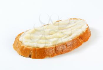 Slice of bread spread with lard