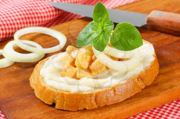 Slice of bread spread with lard and greaves