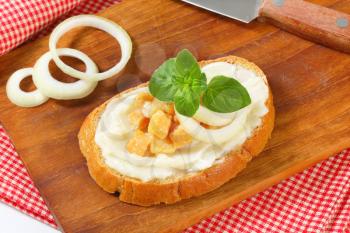 Slice of bread spread with lard and greaves