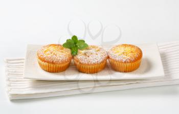 Custard filled muffins on long plate