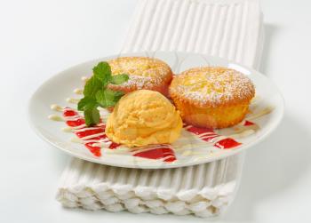 Custard filled muffins with scoop of ice cream