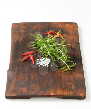 Fresh rosemary sprigs, peppercorns, red chili peppers and sea salt