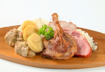 Roast duck and pork meat with three kinds of dumpling and white cabbage
