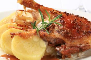 Roast duck leg with potato dumplings and white cabbage