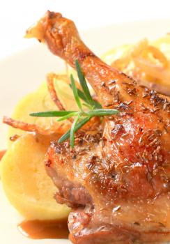 Roast duck leg with potato dumplings and white cabbage