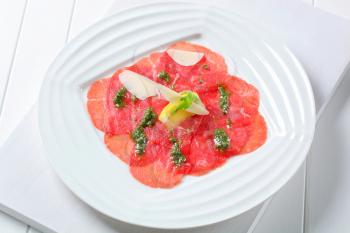 Beef Carpaccio with pesto sauce and shavings of Parmesan