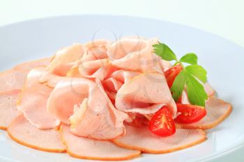 Thinly shaved cured chicken breast