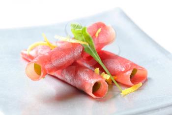 Thin slices of raw beef - rolled up