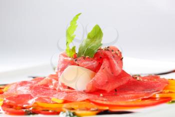 Beef Carpaccio on nest of thinly sliced bell peppers