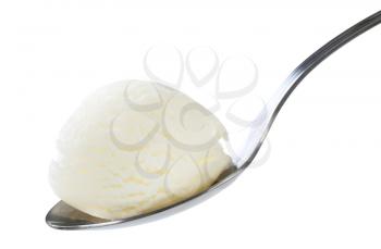 White ice cream on metal spoon