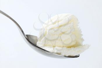 Frozen yogurt on metal spoon