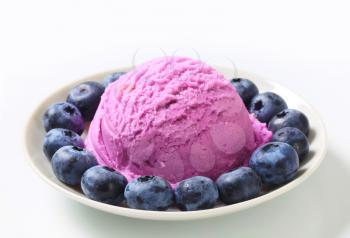Scoop of ice cream with fresh blueberries