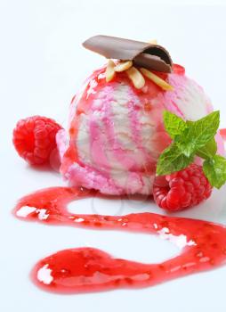Scoop of raspberry ice cream with syrup