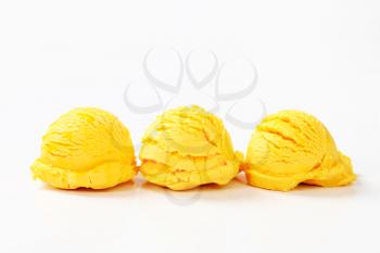 Scoops of orange mango ice cream