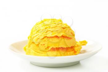 Single scoop of yellow ice cream - studio shot