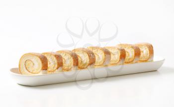 Slices of sponge cake roll with cream filling