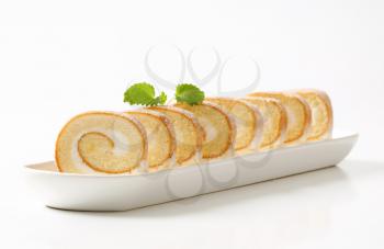 Slices of sponge cake roll with cream filling