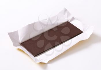 Couverture chocolate bar on paper