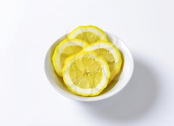 Slices of fresh lemon in a bowl