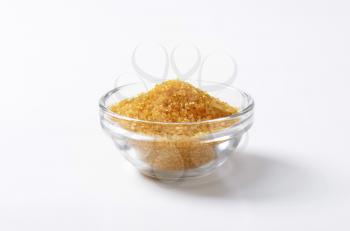 Bowl of golden brown raw cane sugar