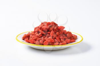 Pile of dried goji berries on plate