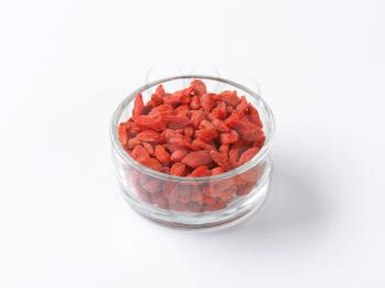 Dried goji berries in small glass bowl
