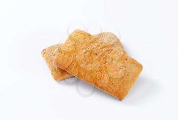 Two gingerbread biscuits on white background