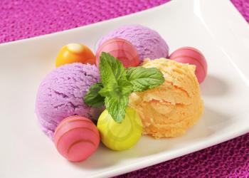 Fruit-flavored ice cream and white chocolate bonbons with fruit ganache filling