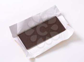 Couverture chocolate bar on paper