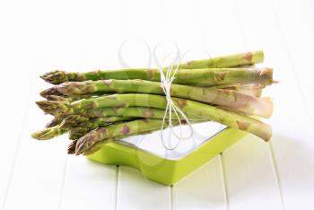 Fresh asparagus spears tied in a bundle