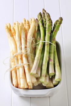 Bundles of fresh white and green asparagus spears