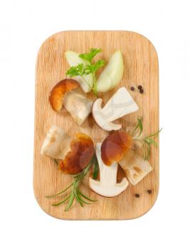 Fresh edible mushrooms on cutting board