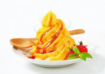 Fruit soft serve ice cream with raspberry sauce
