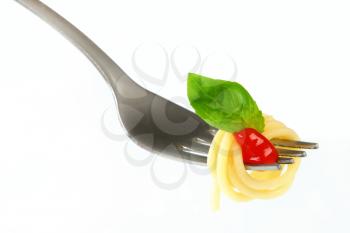 Spaghetti with ketchup twirled on fork