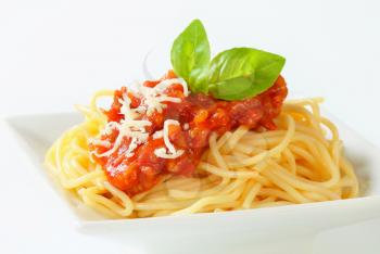Spaghetti with meat-based tomato sauce and cheese