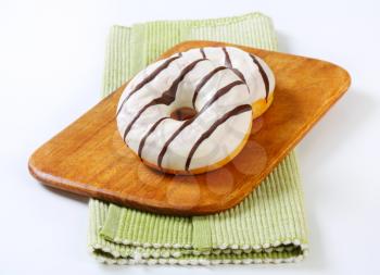 Ring donuts with vanilla and chocolate glaze