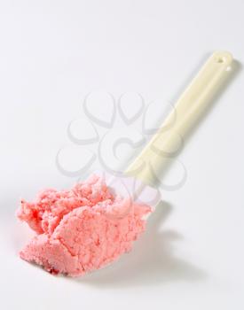 Strawberry ice cream on a kitchen spatula