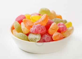 Fruit-shaped gummy candy coated in granulated sugar