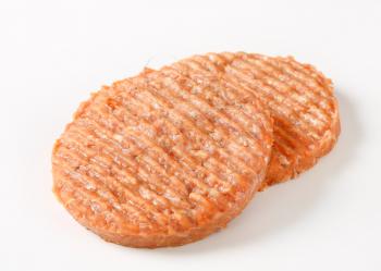 Studio shot of raw burger patties 