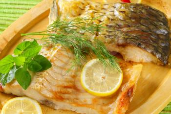 Oven baked carp fillet with lemon and dill