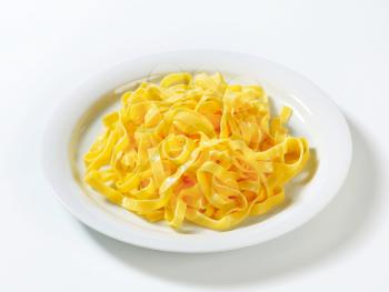 Cooked ribbon pasta on plate