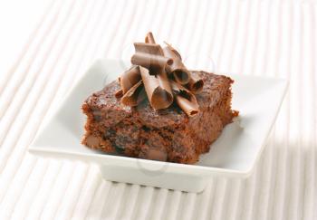 Brownie topped with chocolate curls