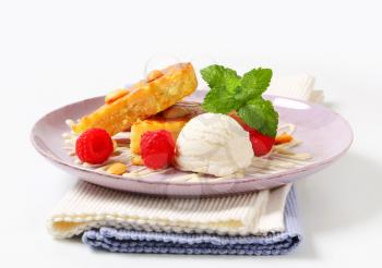 Almond cake with ice cream and fresh raspberries