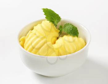 Curls of fresh butter in glass bowl