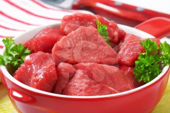 Raw diced beef in a pan