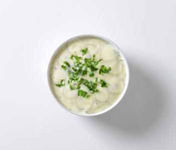 Bowl of mayonnaise dressing with parsley