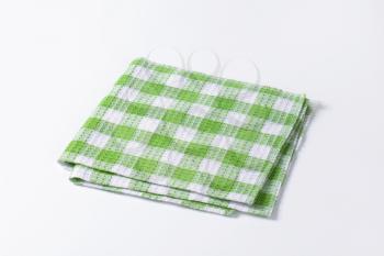 Checked green and white tea towel