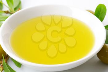 Olive oil in white porcelain bowl